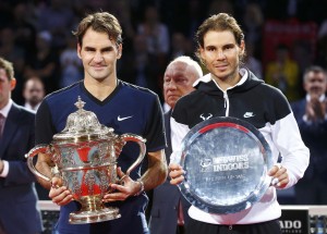 Switzerland's Federer holds the trophy after winning his match against Nadal of Spain at the Swiss Indoors ATP men's tennis tournament in Basel